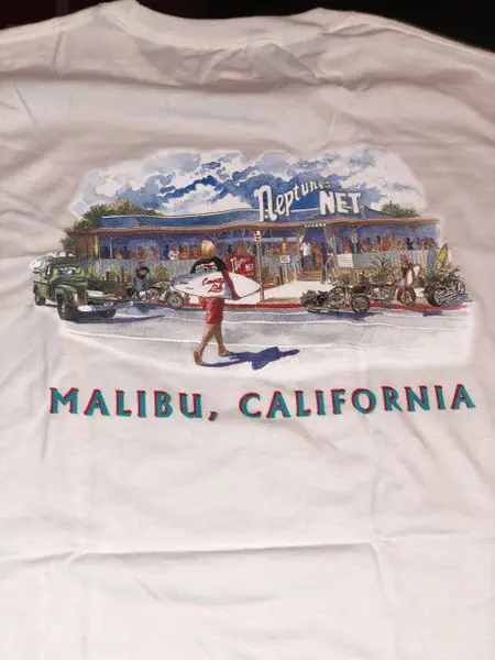 A white t-shirt with a picture of a diner.