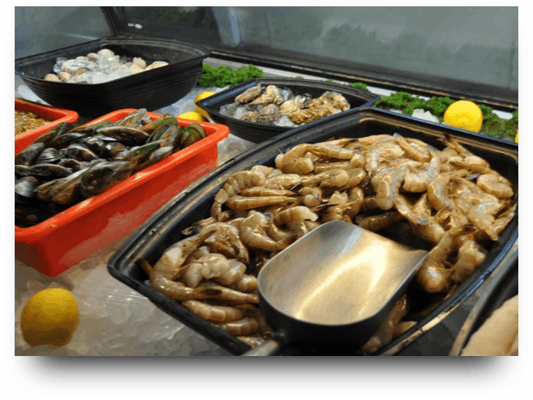 A tray of food with meat and vegetables on it.